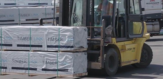 timber being lifted on to crate