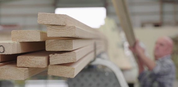 pile of timber on car