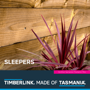 Front cover of Timberlink's sleeper guide. Shows a purple plant in front of a sleeper garden wall
